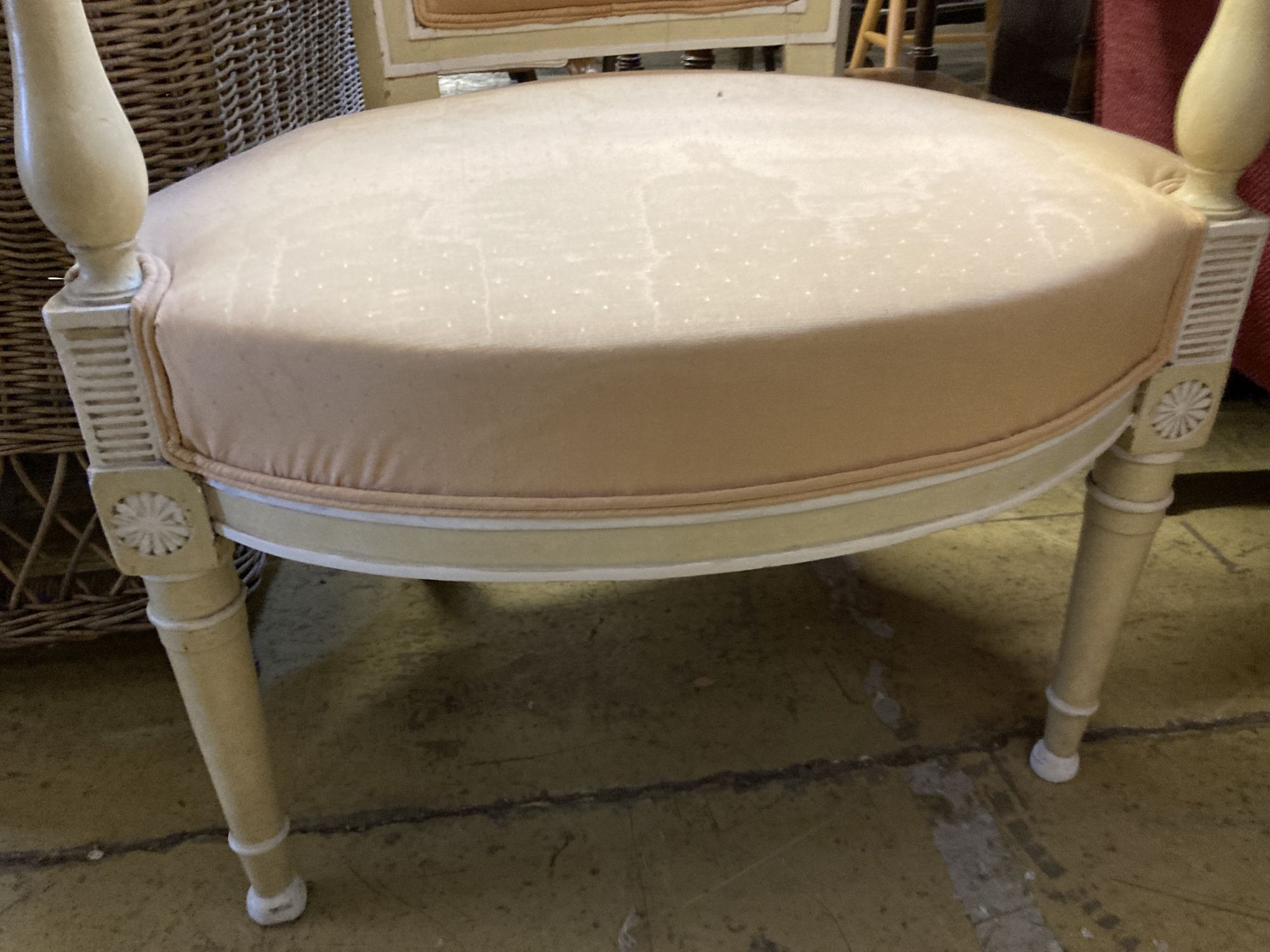 A Louis XVI style cream and white painted fauteuil, width 56cm, depth 48cm, height 88cm
